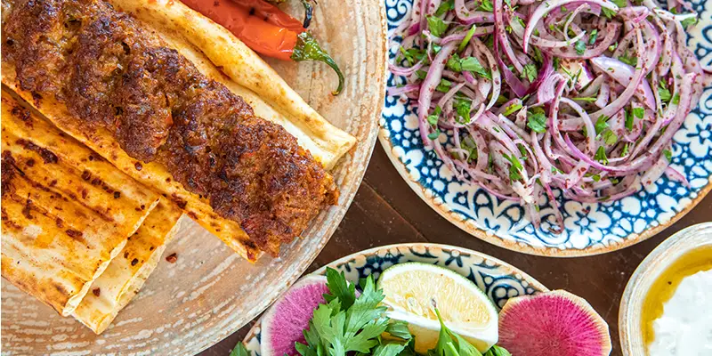 Adana Kebabın İncelikleri: Zırh Kıyması ve Dede İkramları